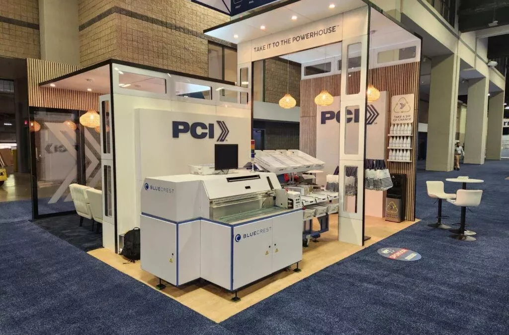 Postal Center International™ Unveils New Custom Tradeshow Booth Design and Buildout—Complete with Operational BlueCrest Elevate Sorter and Onsite Activations for High Touch, Immersive Experience